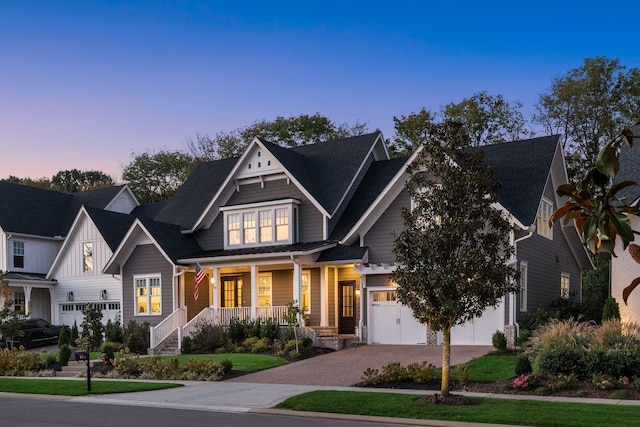 craftsman-style home with a porch and a garage