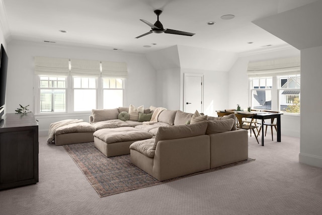 living room with ceiling fan, light colored carpet, lofted ceiling, and ornamental molding