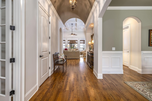 hallway featuring crown molding and dark hardwood / wood-style floors