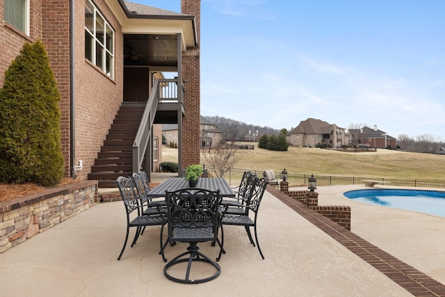 view of patio featuring a fenced in pool