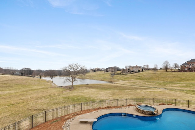 view of swimming pool featuring an in ground hot tub, a water view, and a lawn