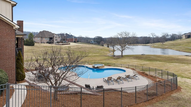 view of pool featuring a patio area, a lawn, an in ground hot tub, and a water view