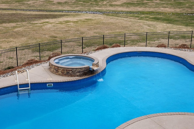 view of pool featuring an in ground hot tub