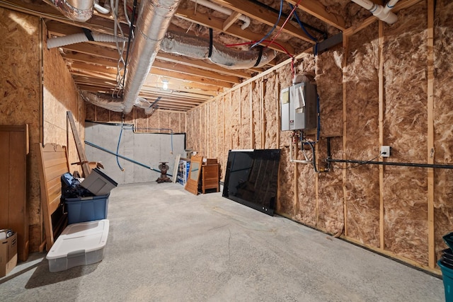 basement featuring tankless water heater