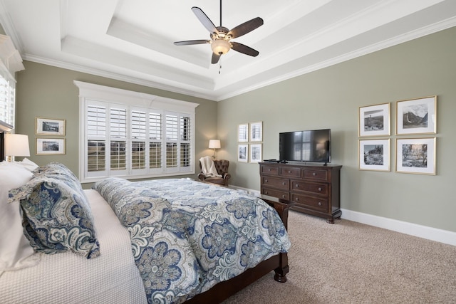 carpeted bedroom featuring ornamental molding, a raised ceiling, and ceiling fan