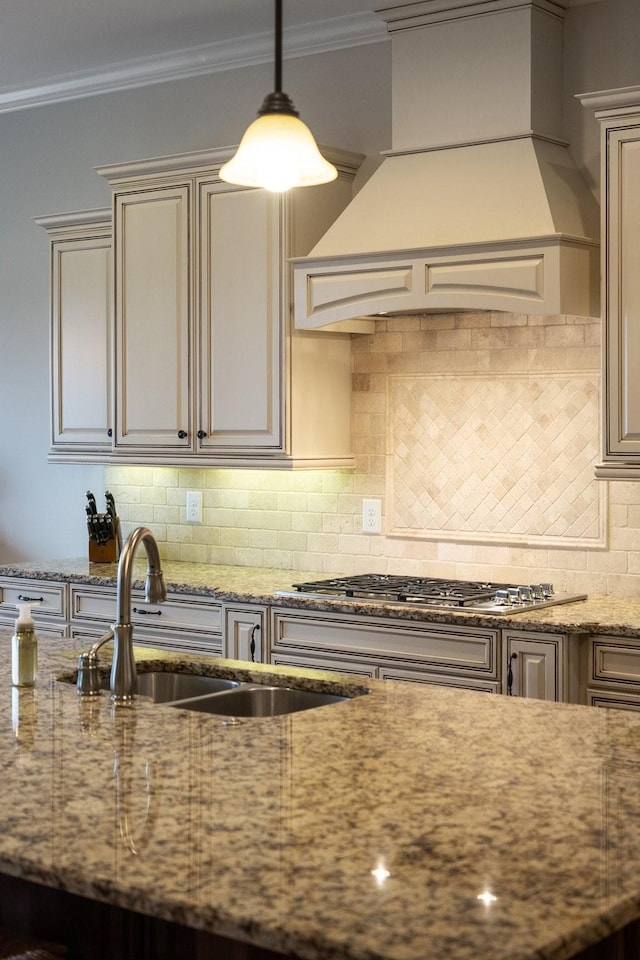 kitchen featuring crown molding, sink, decorative backsplash, and custom range hood