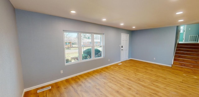 unfurnished room featuring light wood-type flooring