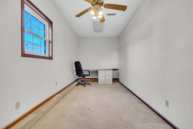 office space with light carpet and ceiling fan