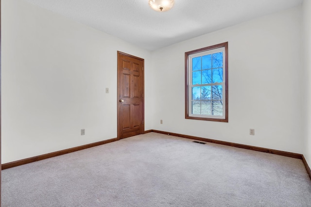 empty room featuring carpet flooring