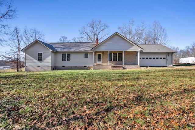 single story home with covered porch, a front yard, and a garage