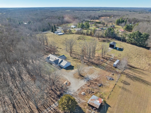 birds eye view of property with a rural view