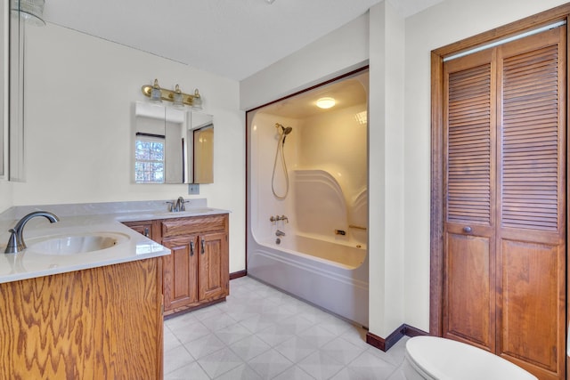 full bathroom with washtub / shower combination, vanity, and toilet