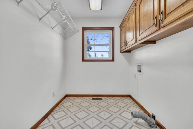 laundry room featuring cabinets and hookup for a washing machine