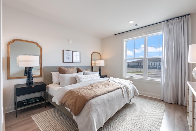 bedroom featuring wood-type flooring