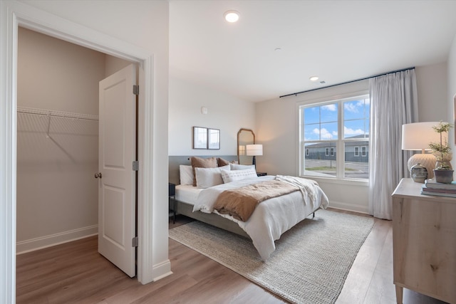 bedroom with light wood-type flooring