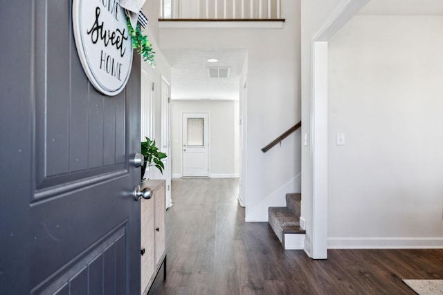 entrance foyer featuring dark hardwood / wood-style flooring