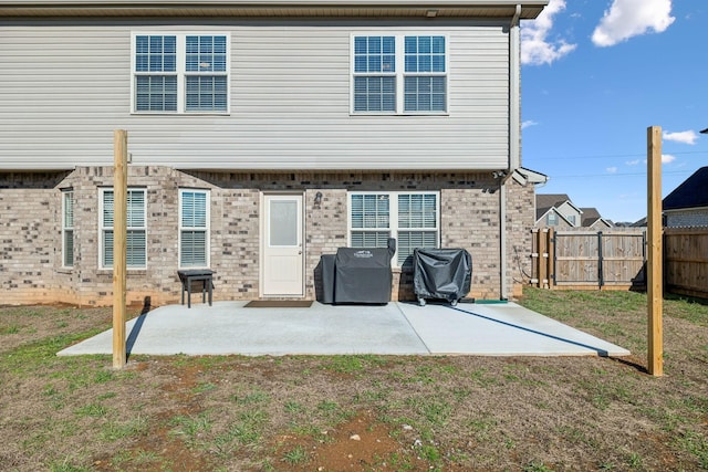 rear view of property featuring a patio