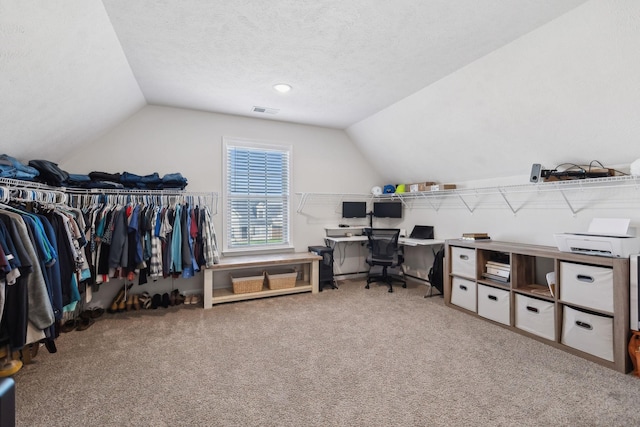 office with carpet flooring, lofted ceiling, and a textured ceiling