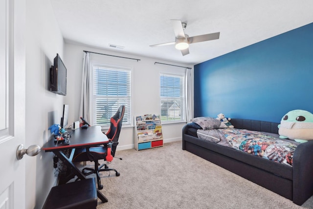 carpeted bedroom with ceiling fan