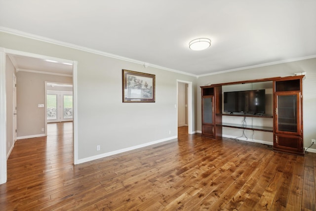 unfurnished living room featuring french doors, wood-type flooring, and ornamental molding