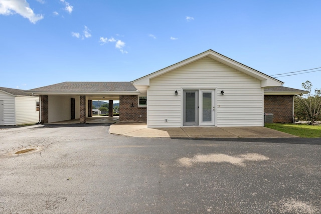 view of front of property with a carport