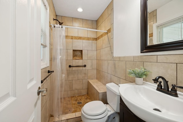 bathroom featuring curtained shower, vanity, and toilet