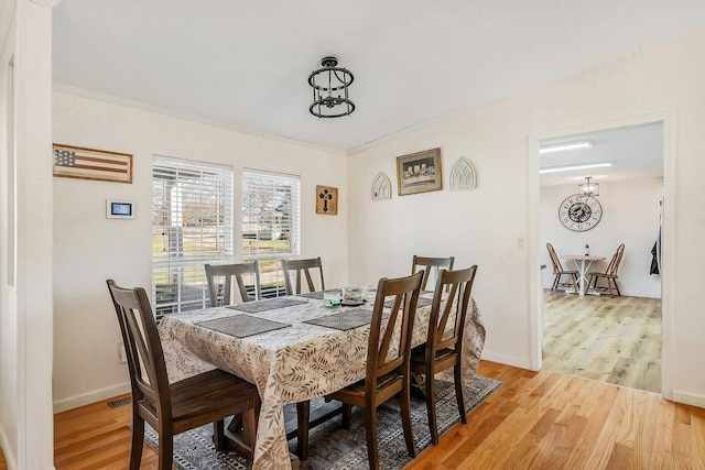 dining space featuring light hardwood / wood-style flooring