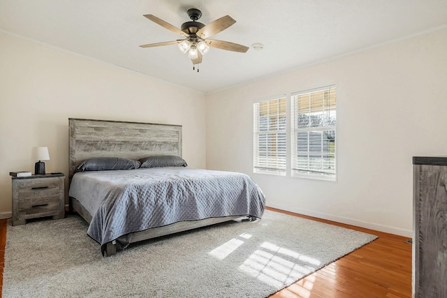 bedroom featuring ceiling fan and wood-type flooring