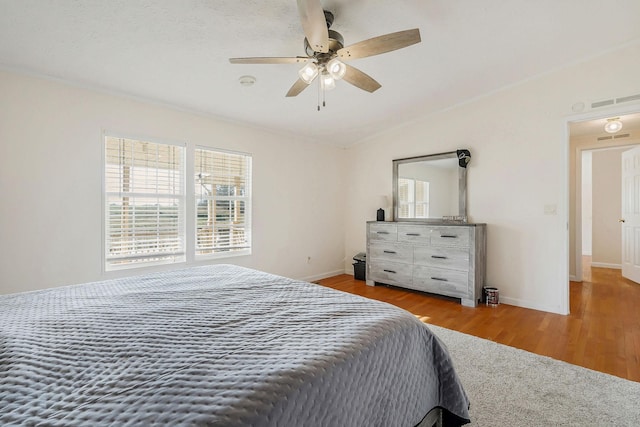 bedroom featuring ceiling fan and wood-type flooring