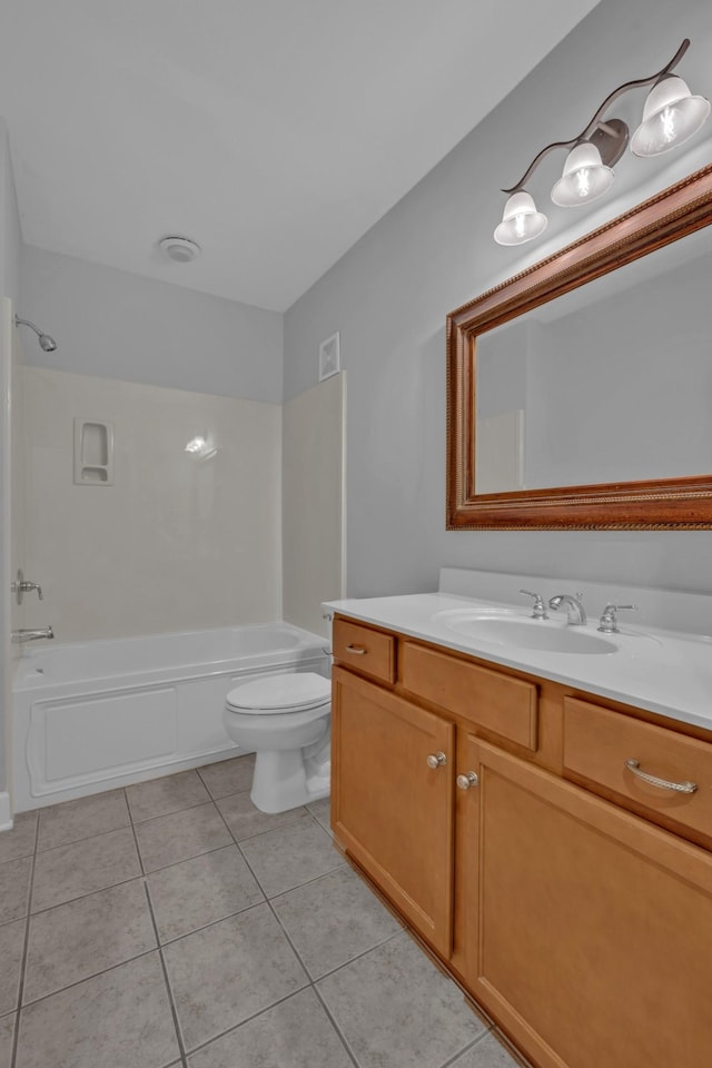 full bathroom featuring tile patterned floors, vanity, toilet, and tub / shower combination