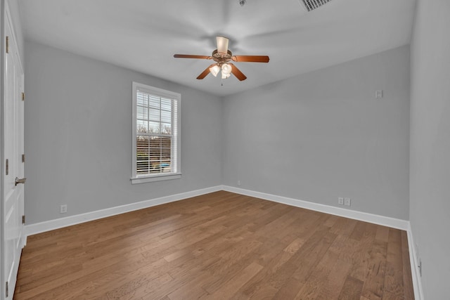 unfurnished room featuring ceiling fan and light wood-type flooring