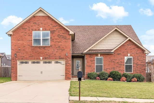 view of property featuring a garage and a front lawn