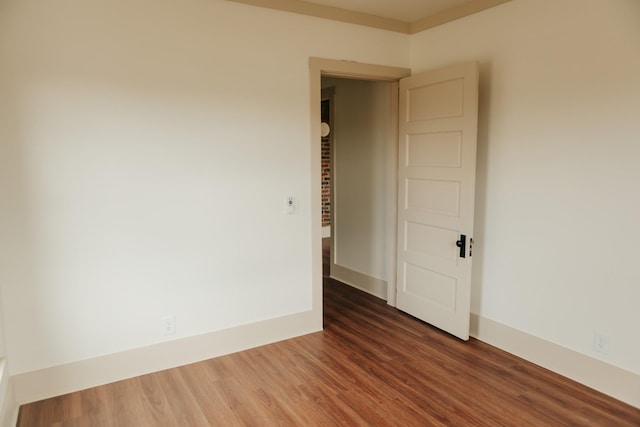 empty room with dark wood-type flooring