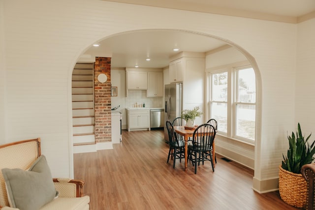 dining space featuring light hardwood / wood-style floors