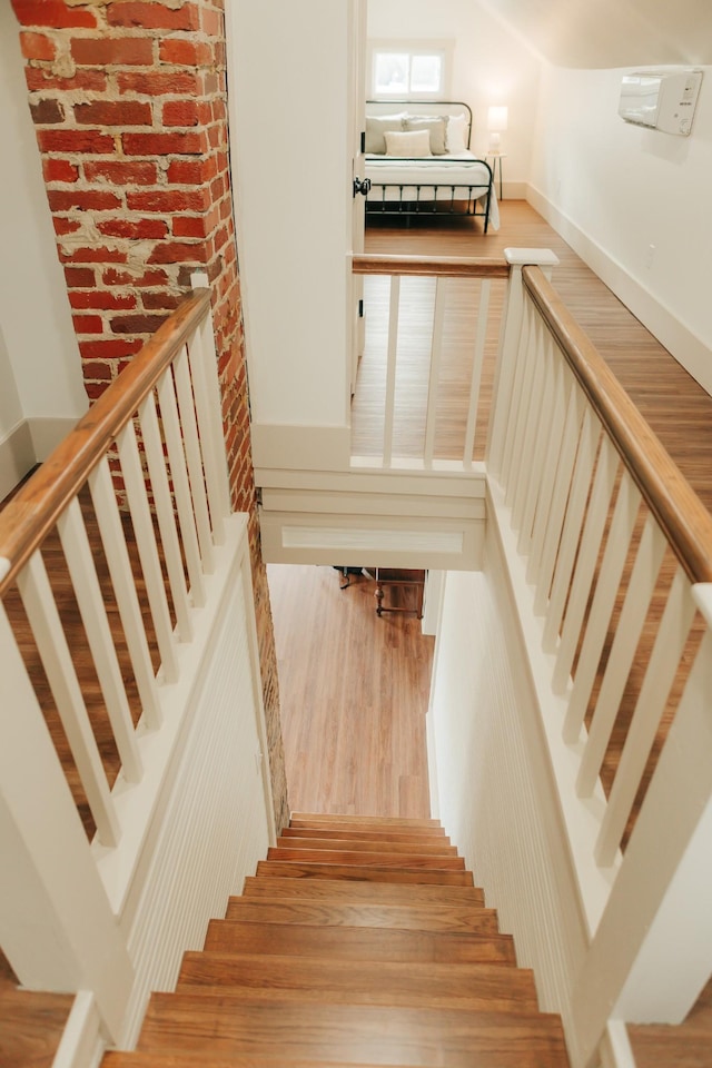 staircase featuring hardwood / wood-style flooring