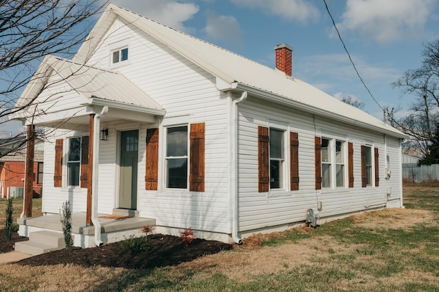 view of side of property with a yard