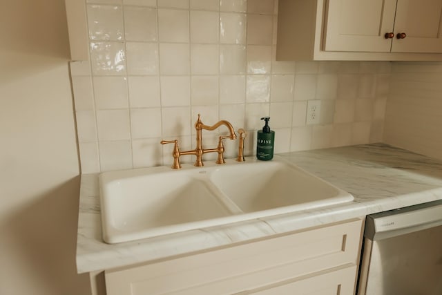 kitchen with decorative backsplash, dishwashing machine, and sink