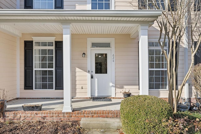 property entrance featuring covered porch