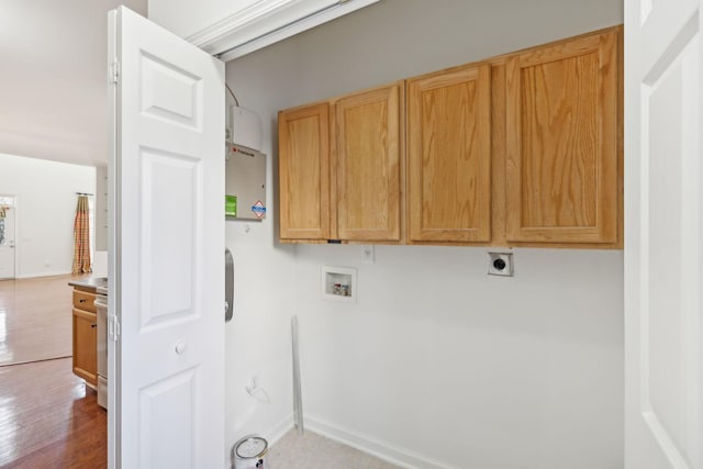 clothes washing area featuring hookup for an electric dryer, hookup for a washing machine, cabinets, and hardwood / wood-style floors