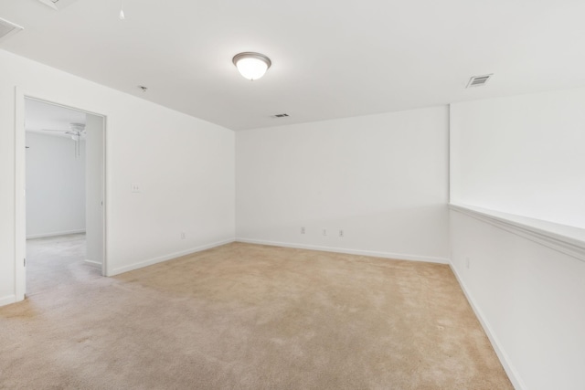 unfurnished room with light carpet