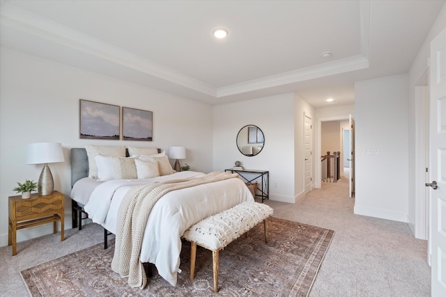 bedroom featuring a tray ceiling, recessed lighting, light colored carpet, and baseboards