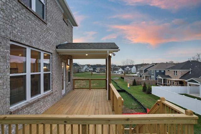 deck at dusk with a yard