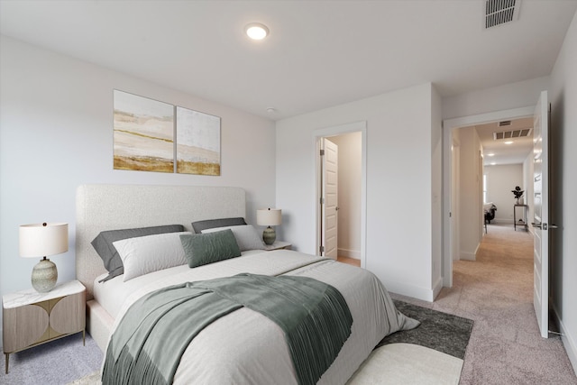 bedroom featuring baseboards, visible vents, and light colored carpet