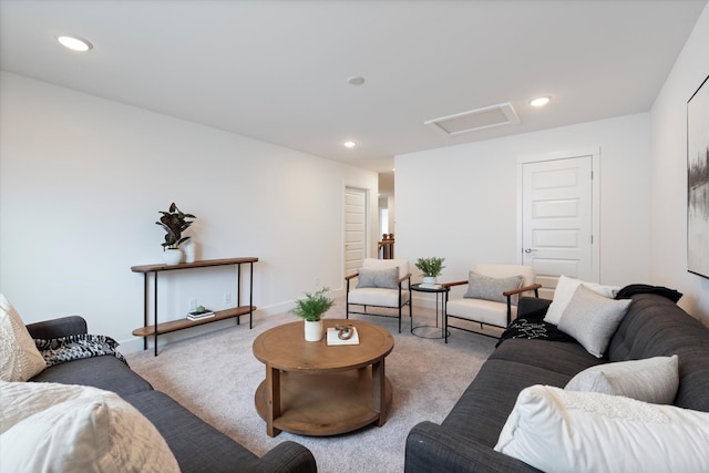 living area featuring carpet, attic access, baseboards, and recessed lighting