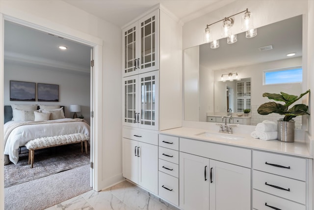 bathroom with visible vents, baseboards, ensuite bath, marble finish floor, and vanity