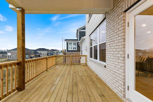 wooden terrace with a residential view