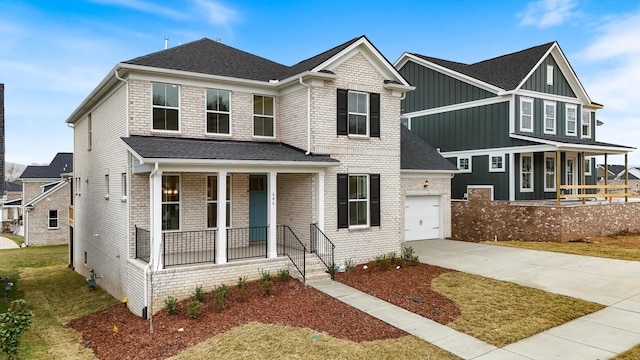 view of front of home with driveway, covered porch, a garage, and roof with shingles