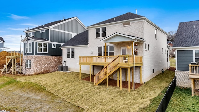 back of house featuring stairs, a deck, and brick siding