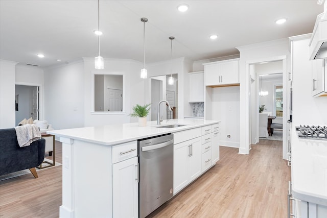 kitchen with light countertops, dishwasher, light wood-style flooring, and a sink