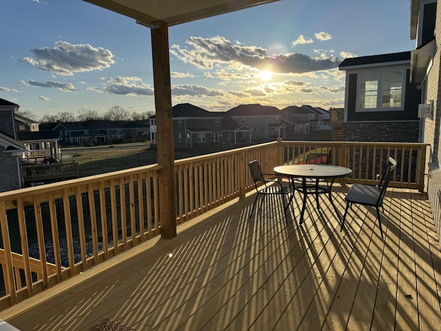 wooden terrace with a residential view